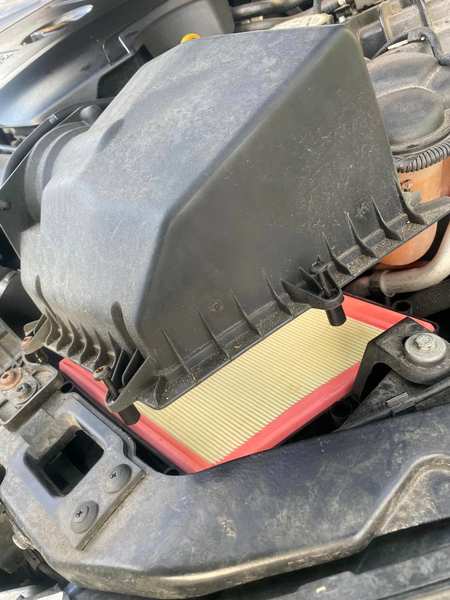 Air filter box opened — fresh filter ready to fit