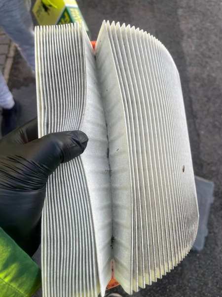Front brake disc and pads — off the car