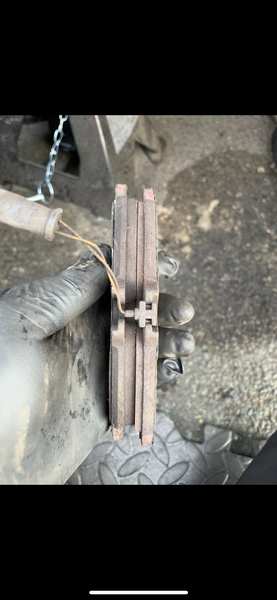 Brake pad wear — minimal material remaining